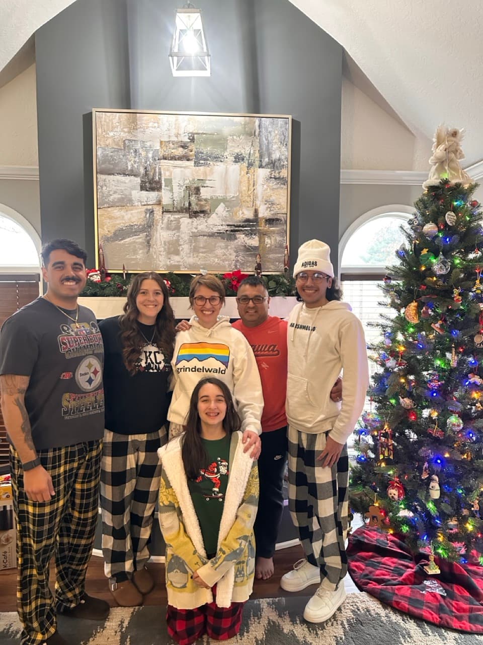 Garrett with his family in matching pajamas at Christmas