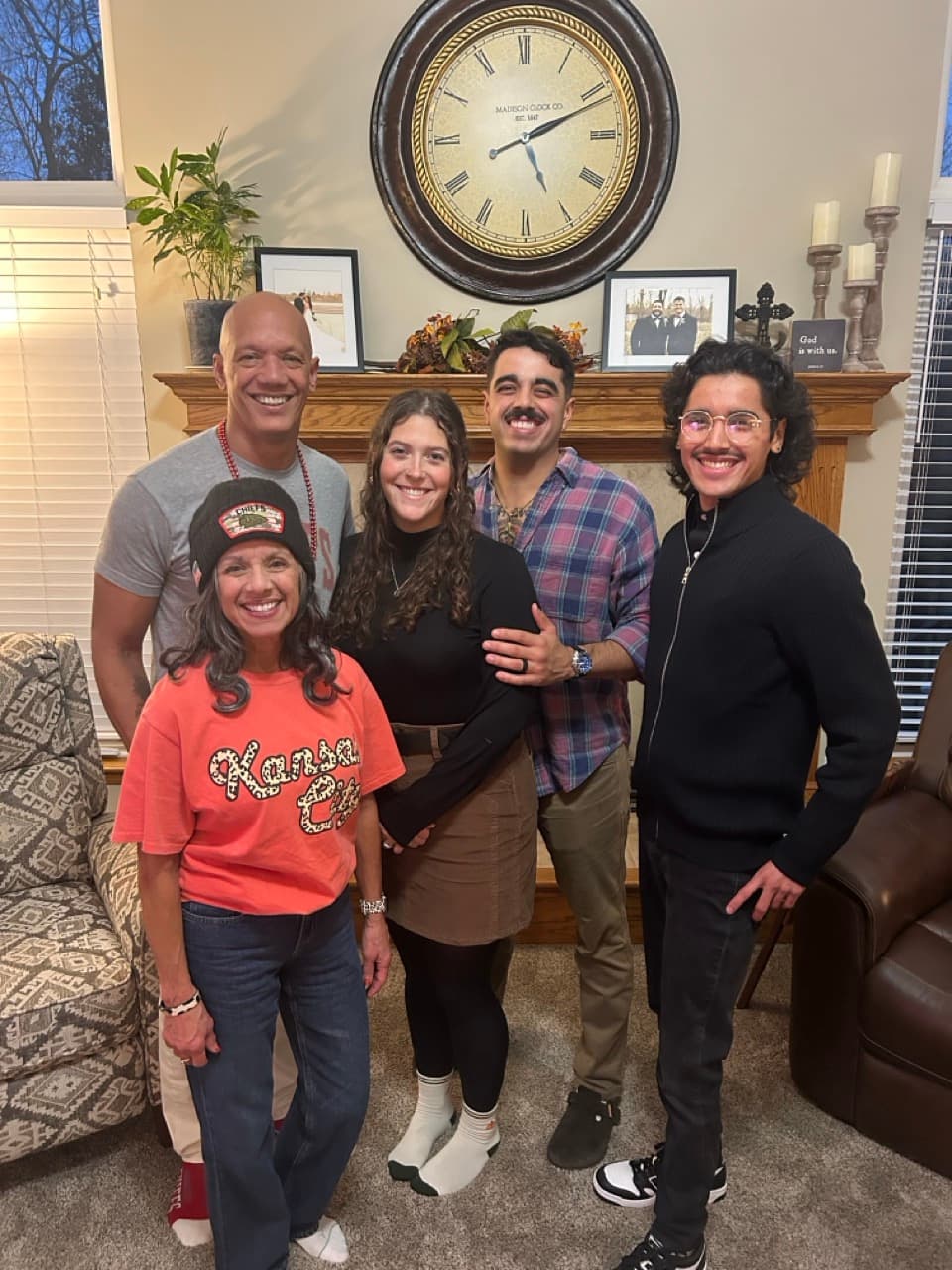 Garrett laughing with his family at home
