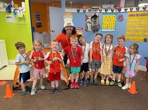 Garrett with a group of young children